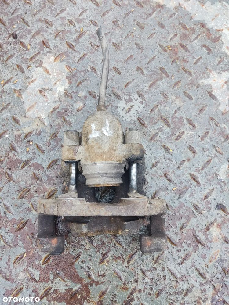 JAGUAR XF X250 3.0D ZACISK HAMULCA PRAWY TYŁ