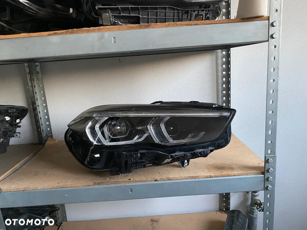 BMW F 44 Lampa reflektor prawy igła