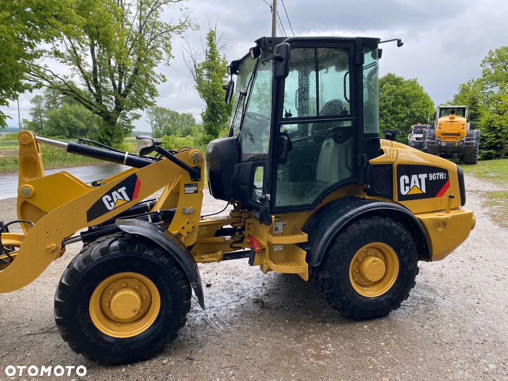 Caterpillar CAT 907H2, 2014 ROK, 6000 MTH, ŁYŻKA OTWIERANA + WIDŁY, z NIEMIEC, SUPER STAN, - 11