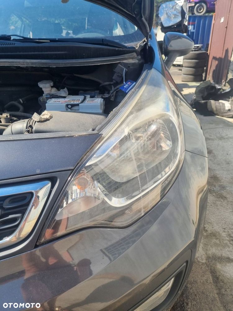 KIA RIO III LIFT 14-17 r. LAMPA LEWY PRZÓD LEWA PRZEDNIA LP EU 92101-1W + - 9