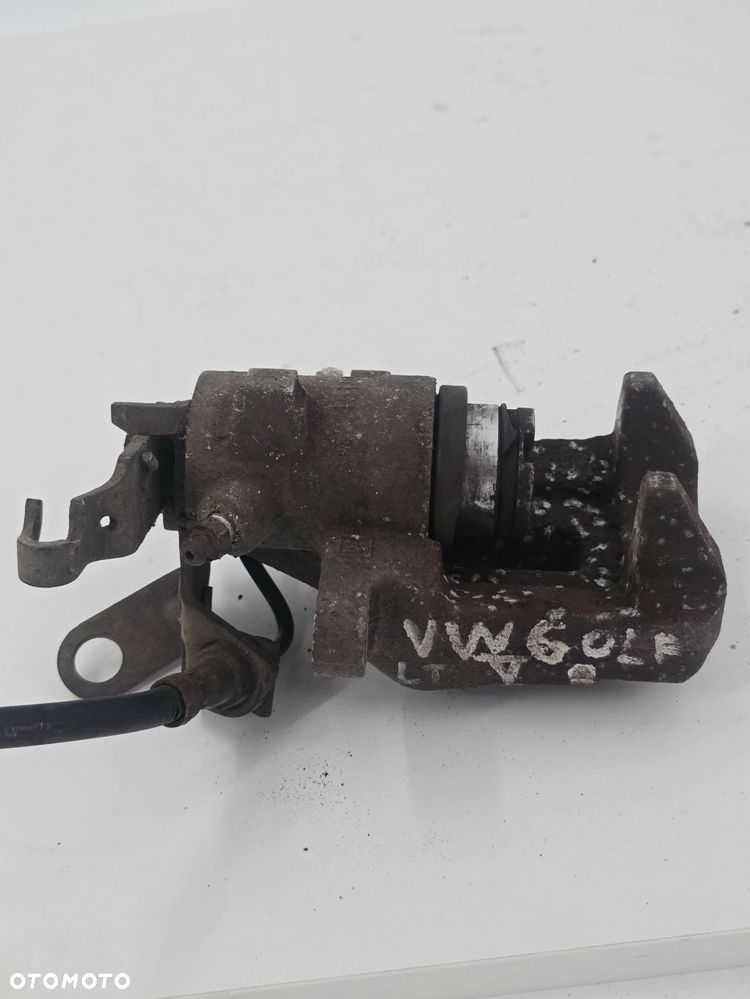 ORYGINALNY ZACISK HAMULCOWY LEWY TYŁ VW GOLF V 1K1 1K0615423 - 4
