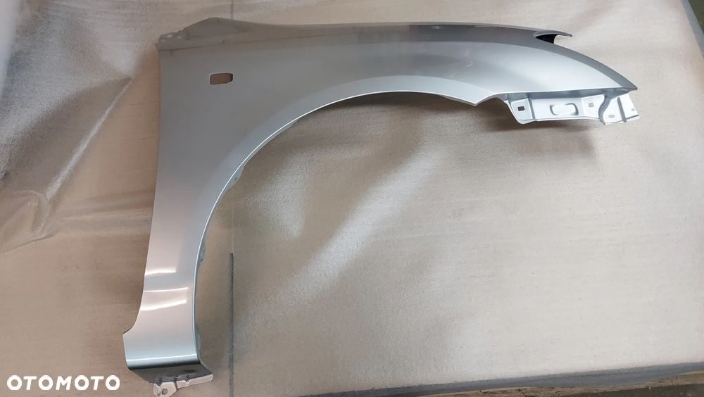 TOYOTA COROLLA E12 02-07 BŁOTNIK LEWY LUB PRAWY HB 1C0 CYNK. - 2