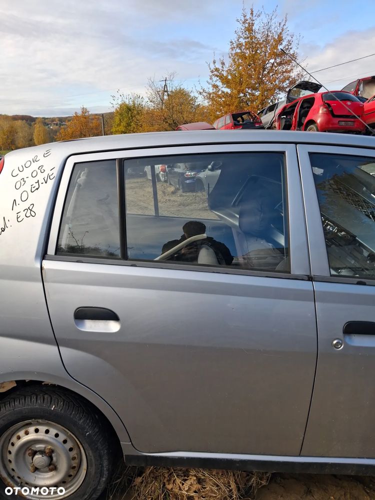 Daihatsu cuore 03 drzwi prawy tyl E28 - 1