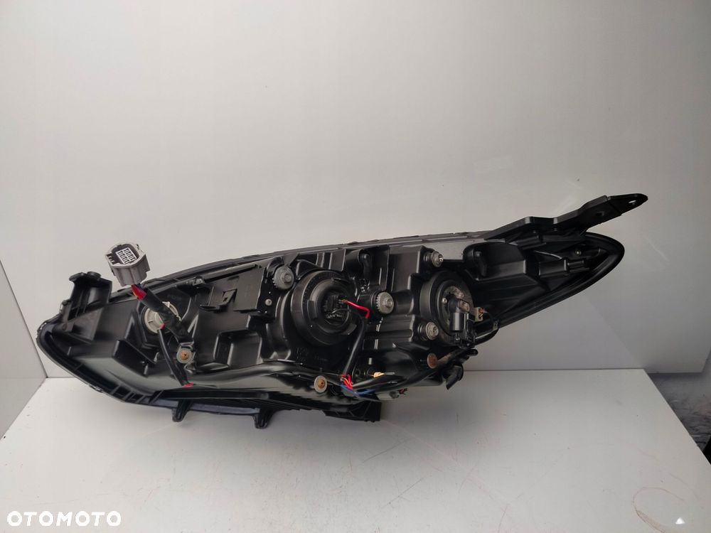 mazda 2 de 2011r reflektor lampa prawy przód prawa przednia soczewka - 10