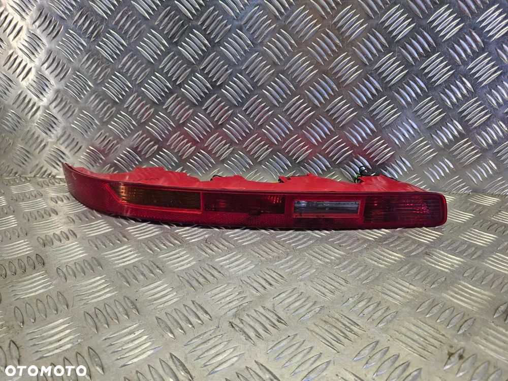 AUDI Q7 4L 05-15R LAMPA TYL PRZECIWMGIELNA ZDERZAKA LEWA 4L0945095 - 1