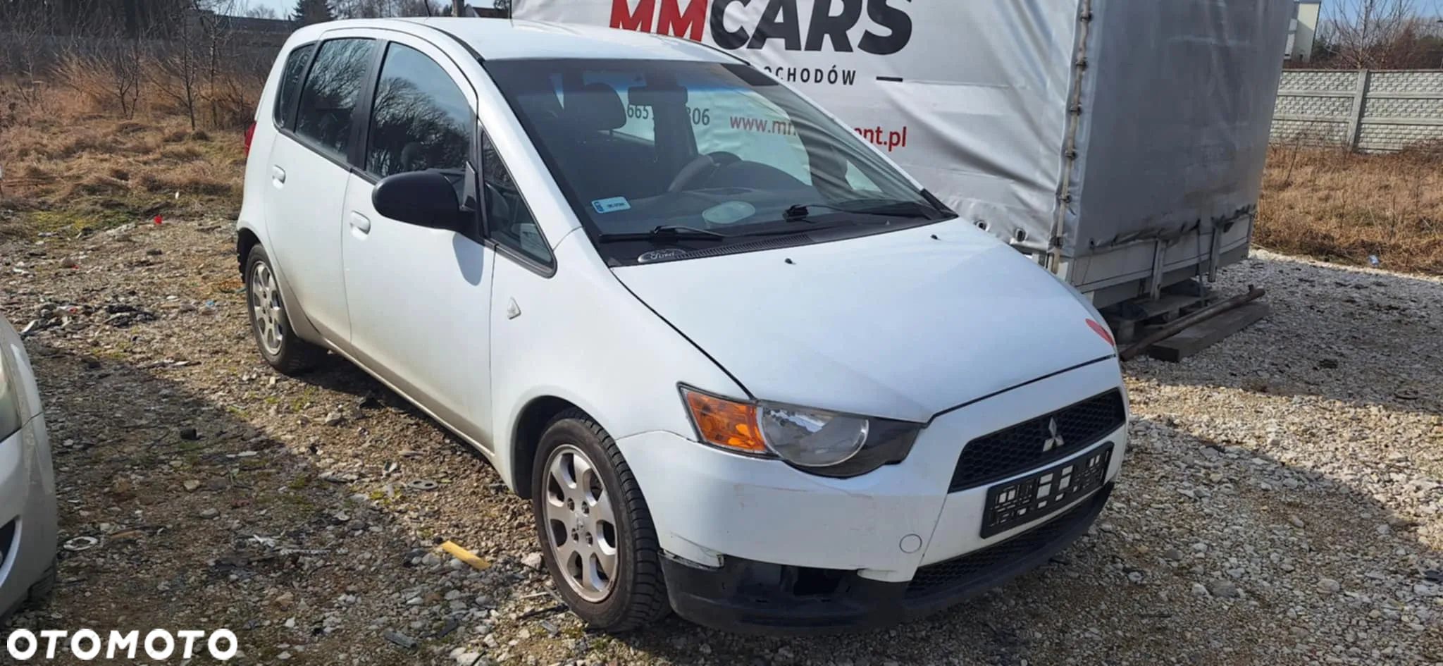 Mitsubishi COLT VI LIFT 1,1 75KM piasta zwrotnica lewy przód - 1