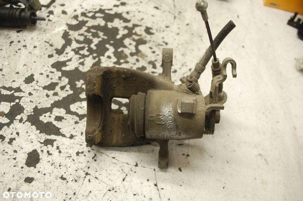 ZACISK HAMULCOWY PRAWY LUB LEWY TYŁ TYLNY SKODA SUPERB II 1.8 TSI SEAT ALTEA VW GOLF V AUDI TRW 518402 518221 - 10