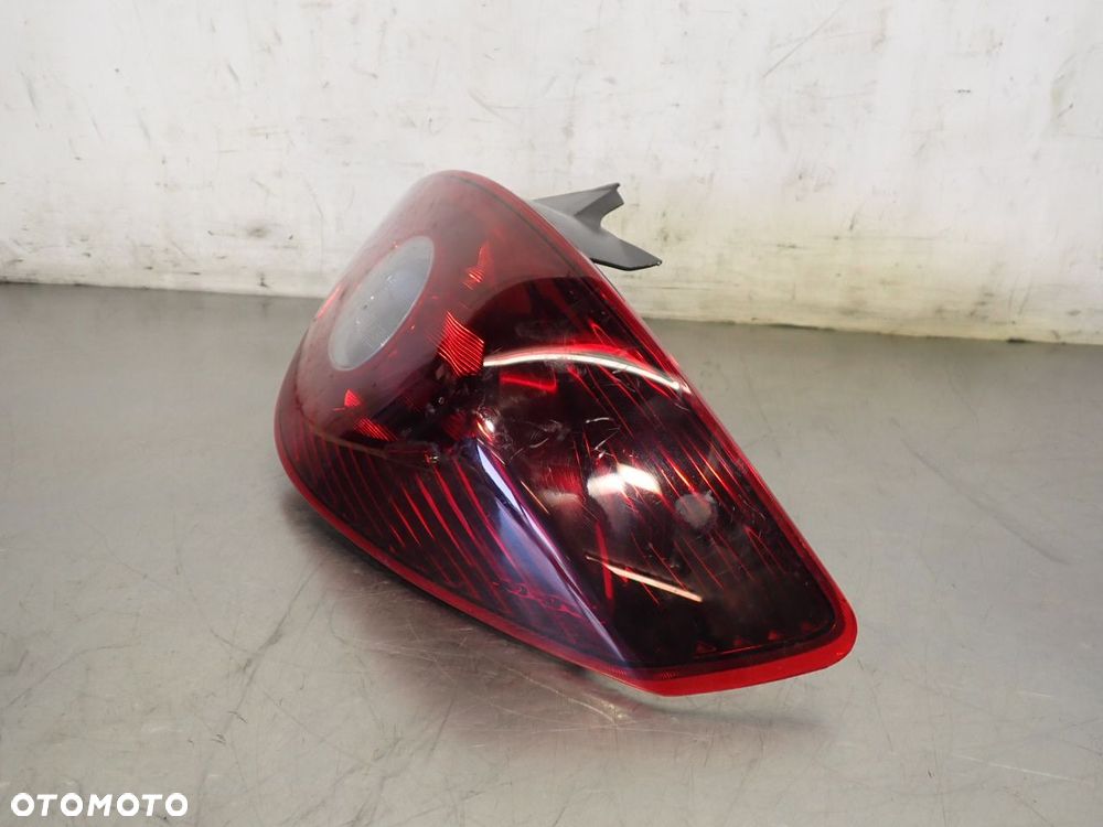 LAMPA PRAWA TYLNA DYMIONA OPEL CORSA D 89316522 - 3