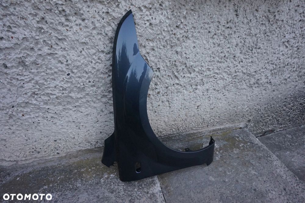 BŁOTNIK PRAWY FOCUS II MK2 04/08r H4 - 2