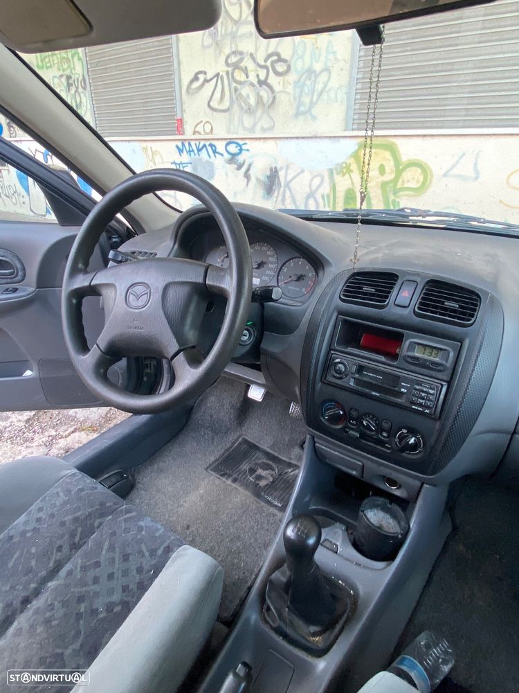 Mazda 323 1.3 - 9