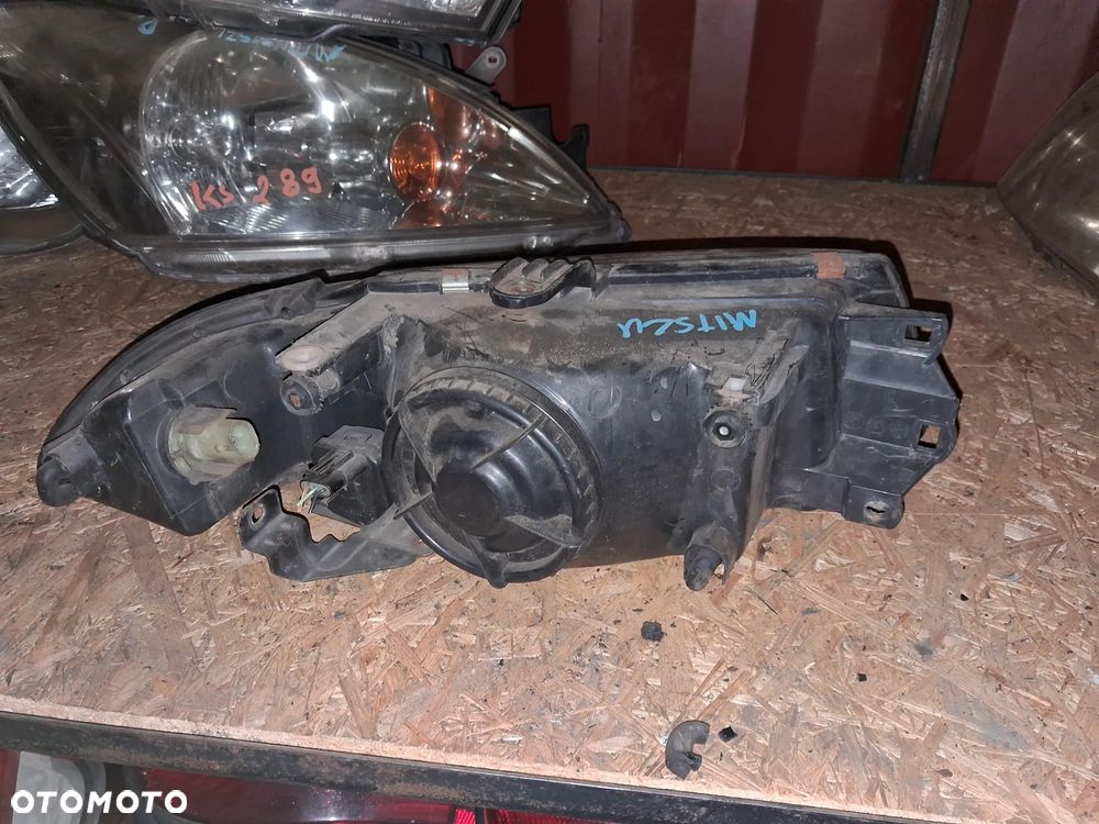 Reflektor LAMPA PRZÓD LEWY LEWA MITSUBISHI CARISMA - 2