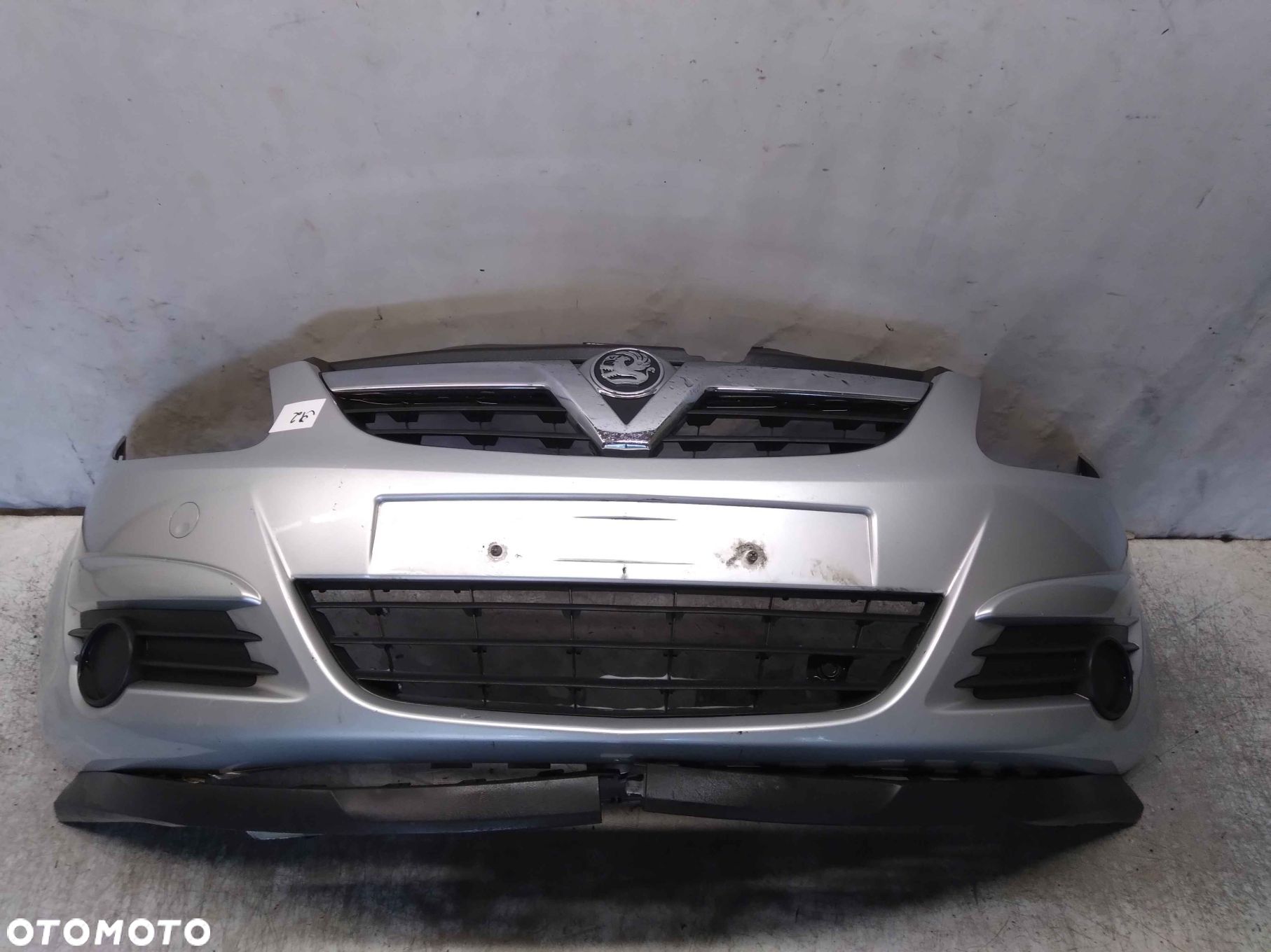 ^ ZDERZAK PRZÓD PRZEDNI OPEL CORSA D Z157 SREBRNY - 1