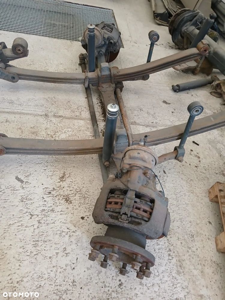 OŚ PRZEDNIA KOMPLETNA  RENAULT MIDLIM 17,5 - 1