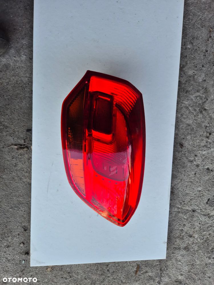 TYLNA LAMPA LEWA OPEL ASTRA J LIFT KOMBI - 1
