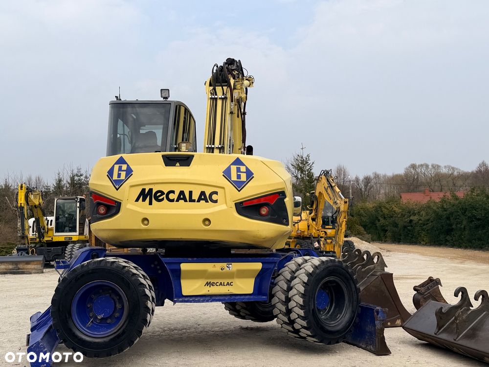 Mecalac Koparka 14 ton MECALAC 15 MWR koparko-ładowarka 3 łyżki widły 1 wł Centr.smarowanie Opony na BLIŹNIAKU 80%Camso ładowarka 714 12MTX 4x4 skrętne KLIMA kabina Premium silnik 146KM volvo EW140B DEUTZ szybka 35km/h - 25