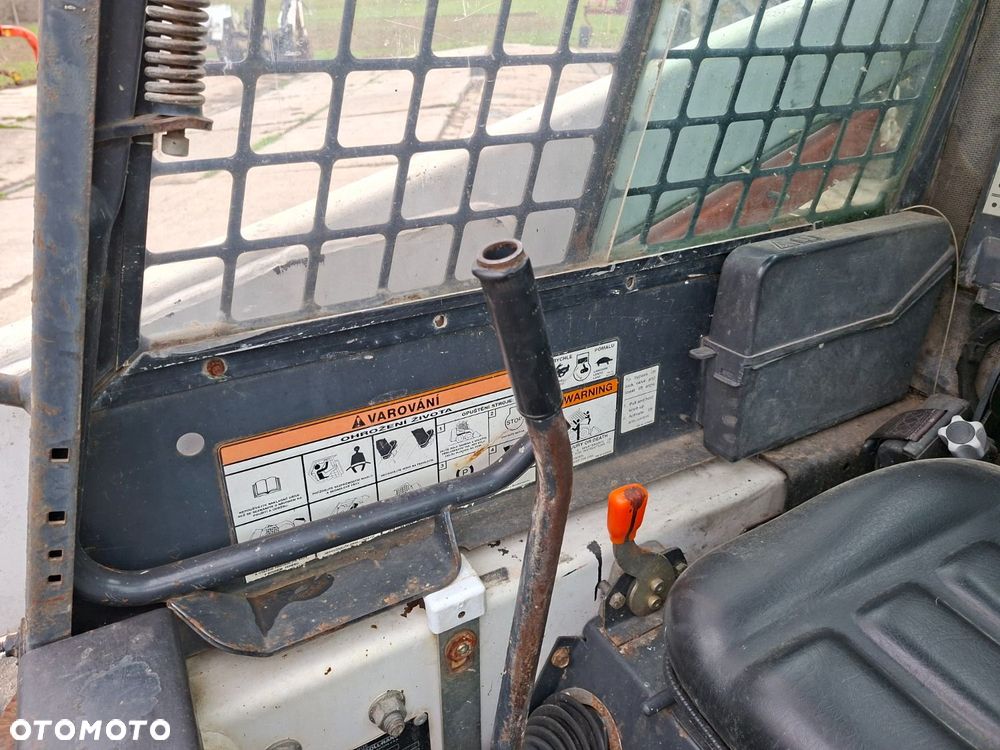 Bobcat 553 4X4 + Melroe Ingersoll-Rand 725S B/H - 16