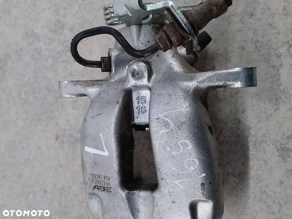 ZACISK HAMULCOWY LEWY TYŁ VW GOLF V TH793 CZH1266 ABE 1.4 TSI - 2