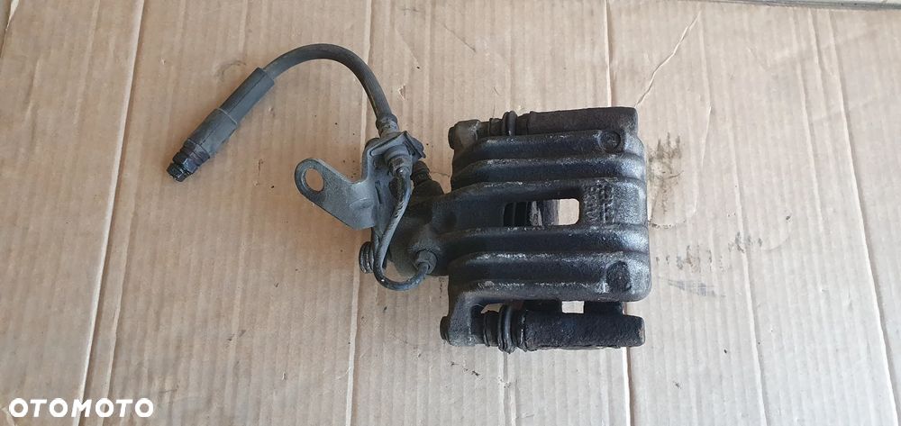 Zacisk hamulcowy lewy tył tylny Audi A3 8P - 1