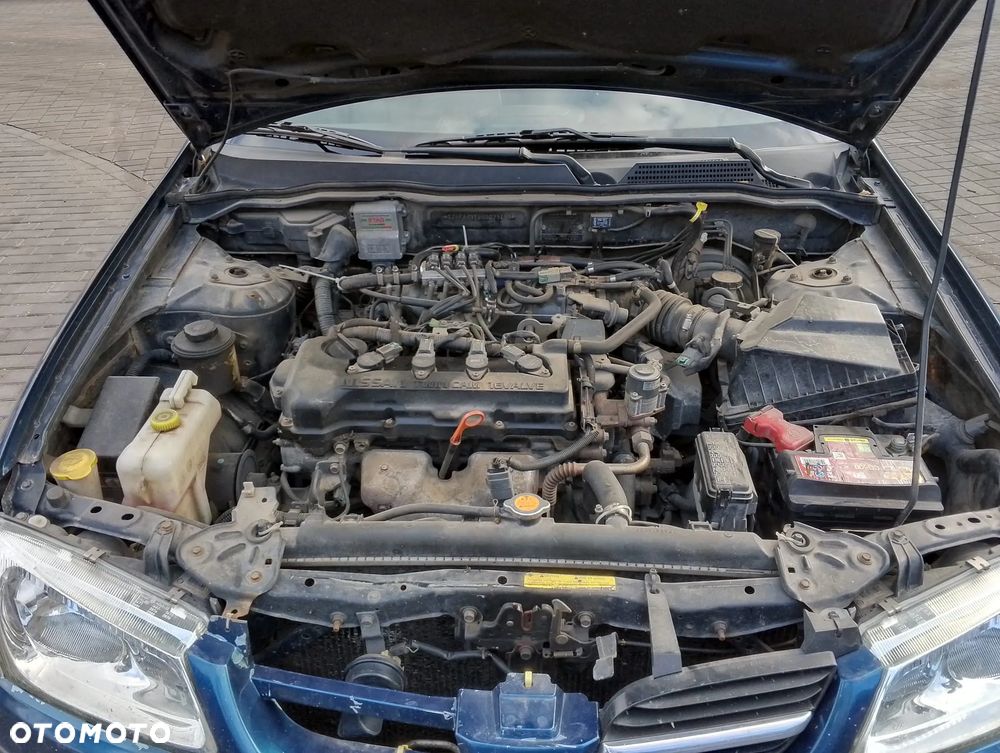 Nissan Almera N16 (00-02.) 1.5 B 89KM. Silnik QG15DE Skrzynia 4M40.Cały na części. GWARANCJA !!! Przód Tył Zestaw Komplet Drzwi Klapa Zderzak Błotnik Maska Grill Atrapa Szyba Pas Lampa Lusterko Boczki Fotel Kanapa Kokpit Deska Rozdzielcza Przełącznik Włącznik Sterownik Przewody Wiązka Instalacja Moduł Komputer Czujnik Listwa Pompa Alternator Wtryski Głowica Rozrusznik Kompresor Sprzęgło Dwumas Silnik Skrzynia ABS Klimatyzacji Paliwa Wspomagania Kolektor Turbina Przepustnica Zawór Chłodnica Koło Hak Belka Sanki Zawieszenie Mcpherson Półoś Amortyzator Wydech Tłumik Zacisk Most - 6