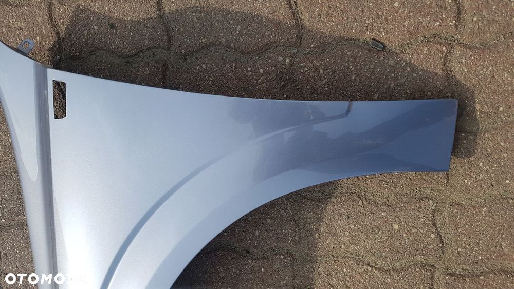 Błotnik przód  lewy  Opel Astra H III kod lakieru Z163 - 5