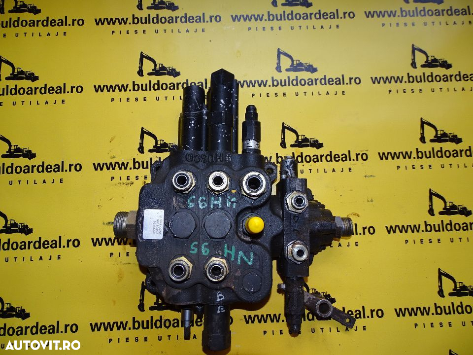 Distribuitor  fata buldoexcavator New Holland LB 110 - 6