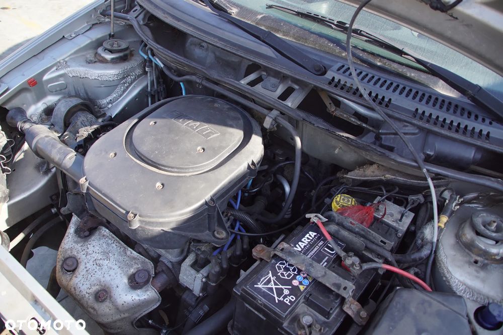 Auto na części - Fiat Punto II 1.2 8V 60 KM 188A4000 2003R Silnik Skrzynia Drzwi Maska Klapa Zderzak Błotnik Szyba Lusterko Deska Kokpit Sterownik Moduł Licznik Kierownica - 16