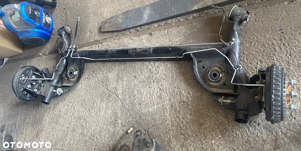 DACIA JOGGER SANDERO 3 III STEPWAY LOGAN III Nowa !!! 2025r PO 4,5 tys km! Igła! OŚ TYLNA BELKA ZAWIESZENIA TYŁ TYLNIA na bębnach bębny hamulec ręczny elektryczny elektryczne zaciski zawieszenie tylne  elektryka bębny ręczny elektryczny na przycisk Wwa - 4