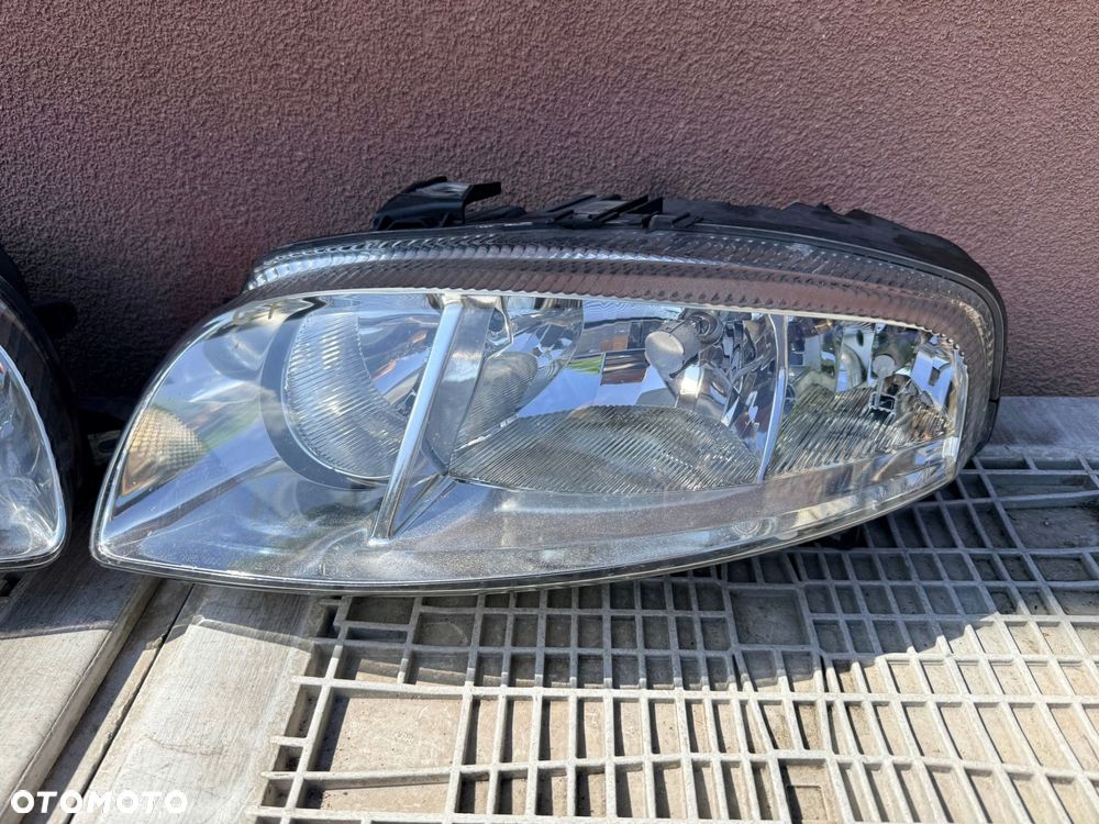 Lampa przednia ALFA ROMEO GT ZWYKŁE KOMPLET EUROPA ORYGINALNE AL - 3