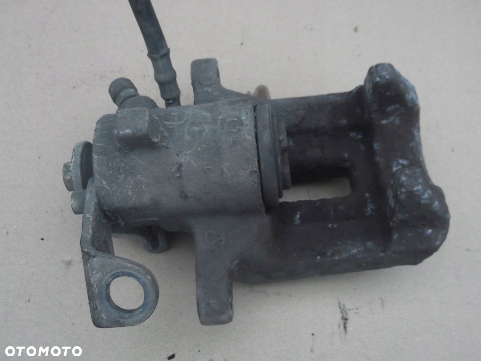 VW POLO III 6N LIFT ZACISK HAMULCOWY LEWY TYŁ EURO - 2