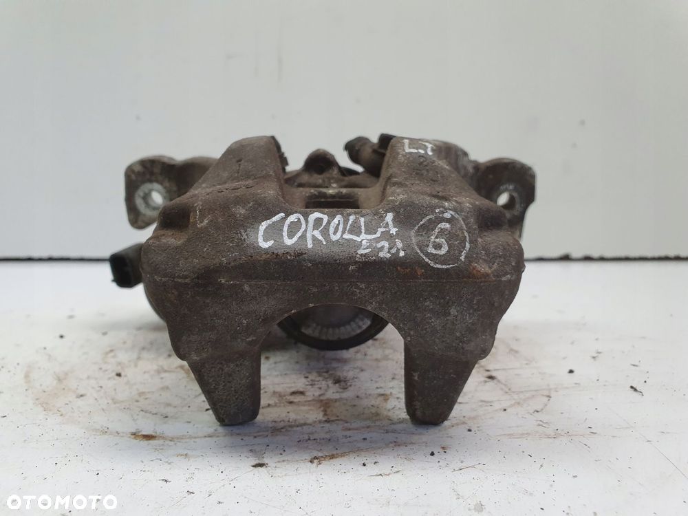 Toyota Corolla XII E21 TYLNY ZACISK HAMULCOWY lewy tył KIEROWCY A006B119B - 2