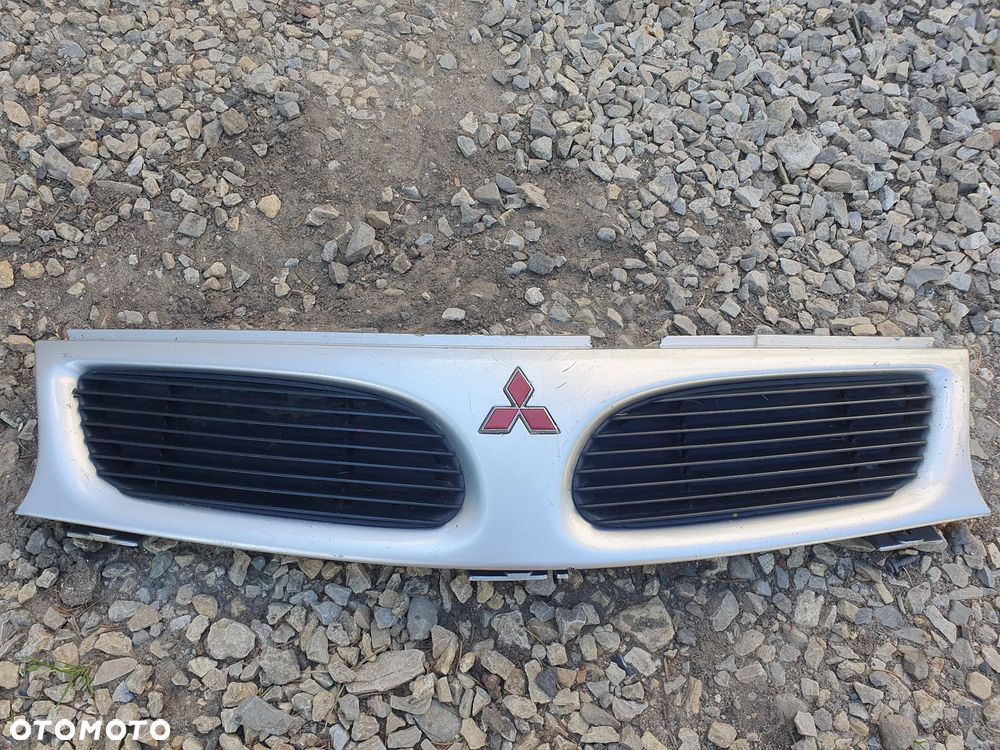 MITSUBISHI CARISMA GRILL PRZEDNIA ATRAPA PRZÓD EMBLEMAT MB944763 - 1