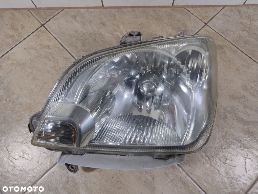 Daihatsu cuore 03-07 lampa lewa przód reflektor Europa wysyłka OLX - 1