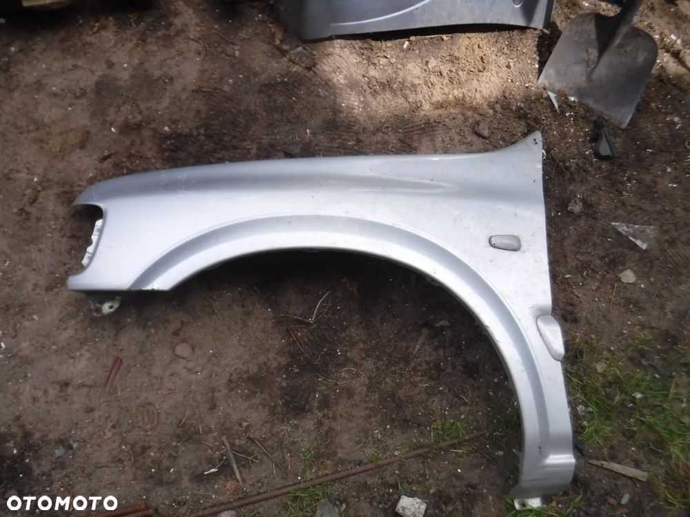 Opel Frontera B Lift blotnik lewy bez rdzy - 1