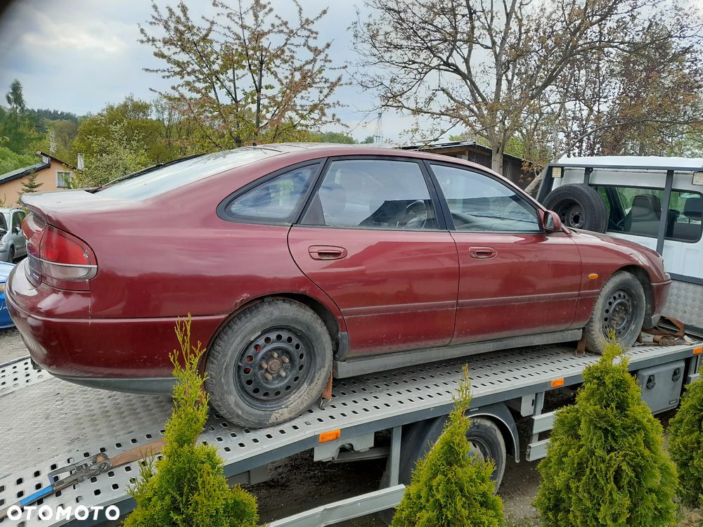 Mazda 626 GF GW 97-02   Maska lampa zderzak zamrk atrapa pas w kolor SU - 10