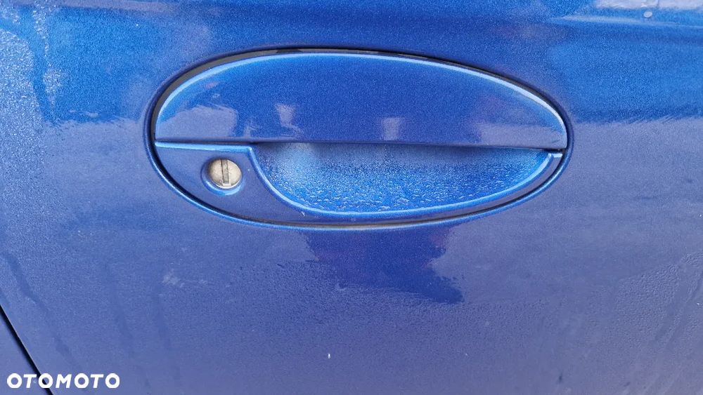 DAEWOO TACUMA CHEVROLET REEZO KLAMKA PRAWY PRZÓD 26V - 1