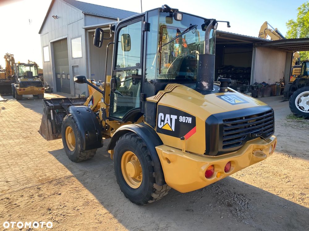 Caterpillar CAT 907H, 2012 ROK, ŁYŻKA OTWIERANA + WIDŁY, z NIEMIEC - 4