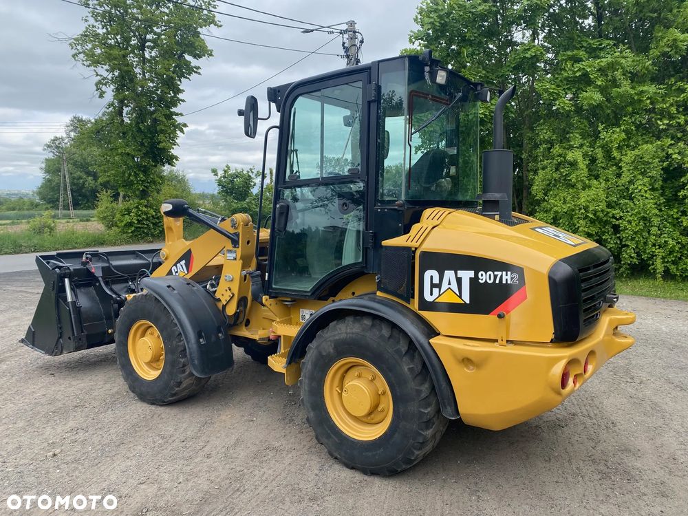 Caterpillar CAT 907H2, 2014 ROK, 4900 MTH, ŁYŻKA OTWIERANA + WIDŁY, z NIEMIEC, - 3