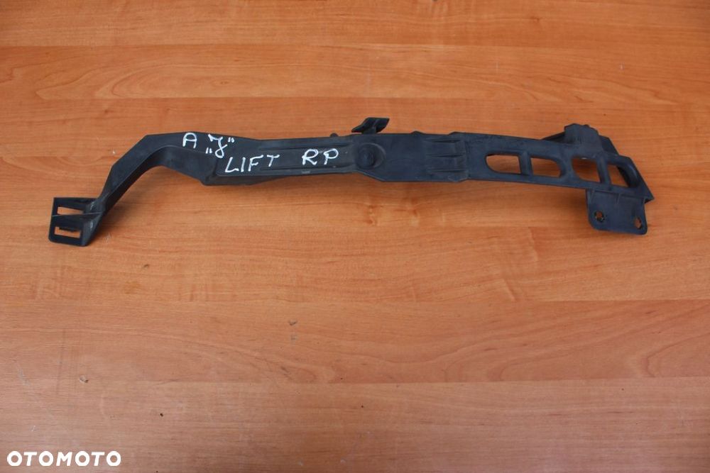 ŚLIZG WSPORNIK MOCOWANIE PODSTAWA LAMPY PRAWY OPEL ASTRA IV LIFTING  13368882 - 1