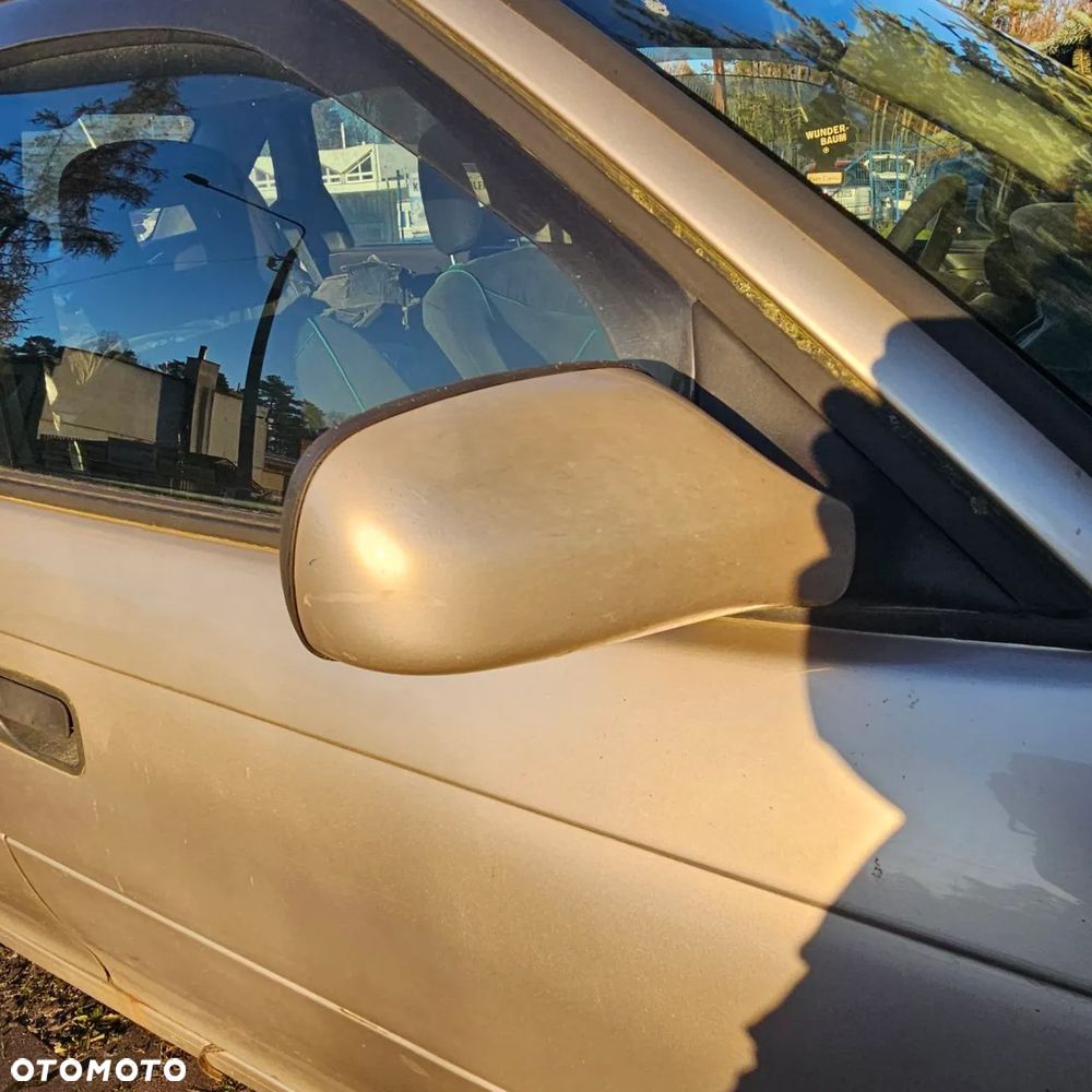 Opel Astra Classic F 1,4 B  (Z489) pojazd na części: maska, zderzak, drzwi, szyby, lusterka, chłodnica - 10