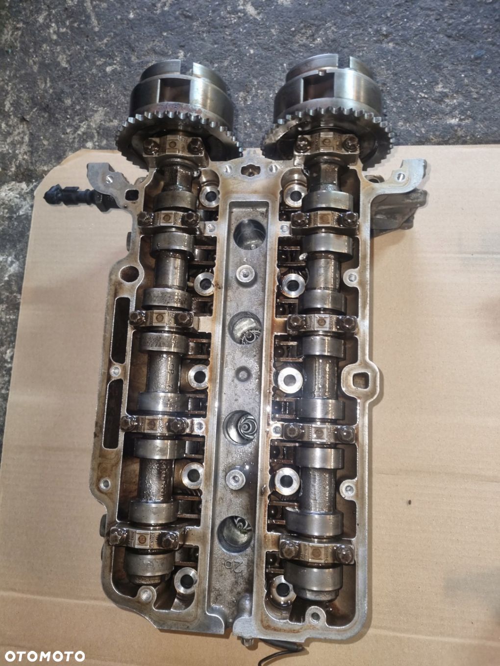 Głowica silnika Opel Corsa Meriva 1.2 16v A12XER 55562229 - 1