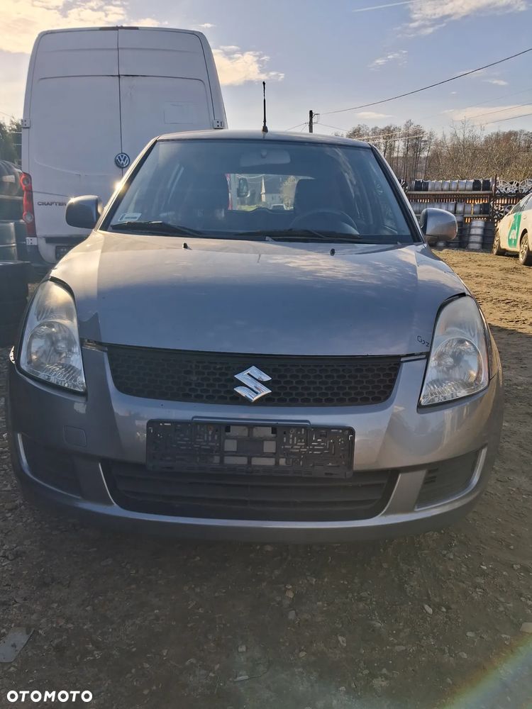 Suzuki Swift 05 zderzak przod ZCD - 1