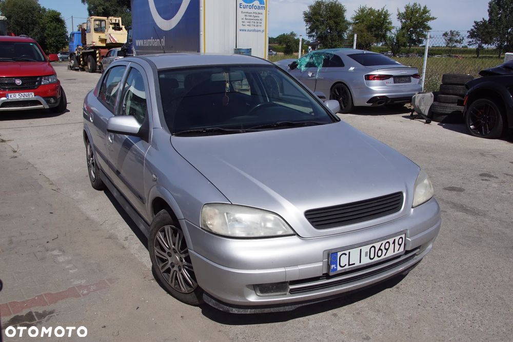 Auto na części - Opel Astra II G 1.6 16V 101 KM Z16XE F17 Z157 2002R Silnik Skrzynia Drzwi Maska Błotnik Zderzak Klapa Lampa Lusterko Klamka Szyba Deska Kokpit Sterownik Moduł Czujnik Licznik Panel Kierownica - 8
