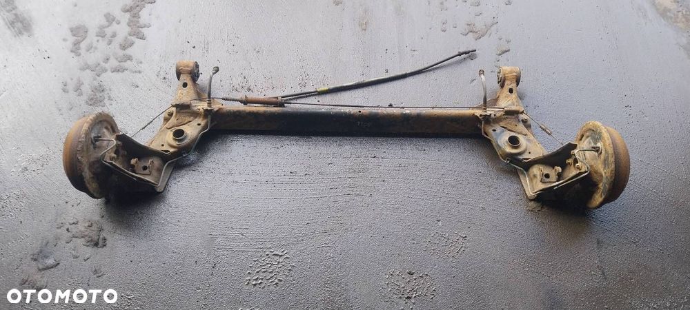 BELKA OŚ ZAWIESZENIA TYŁ BĘBNY BEZ ABS OPEL CORSA C - 1