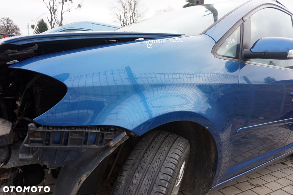 BŁOTNIK PRZEDNI LEWY TOURAN I LIFT FL1 LC5C 1T0821021B NIEBIESKI VOLKSWAGEN 2006-2010 - 3