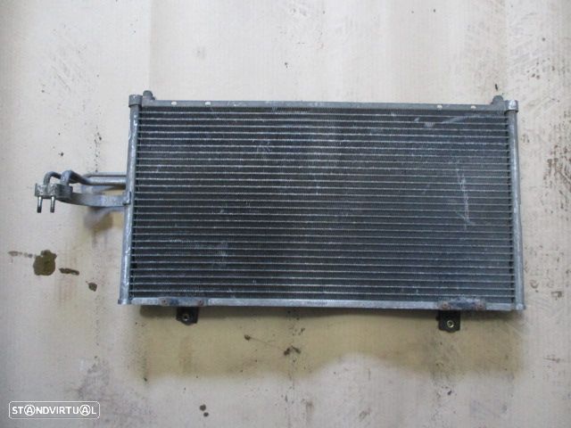 Radiador AC 595X320 KIA SHUMA 1999 1.5 - 1
