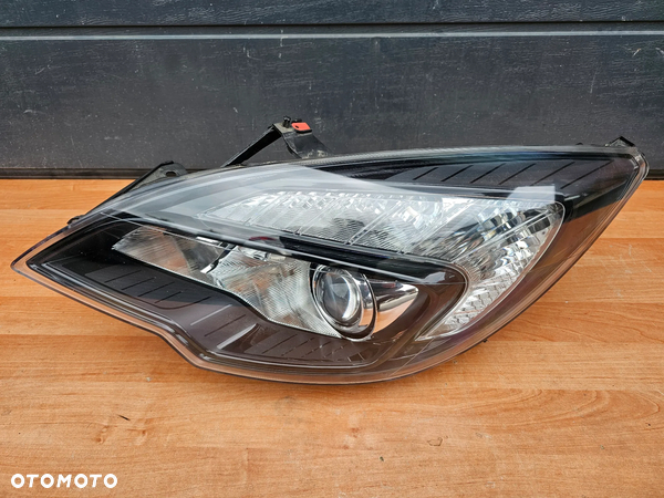LAMPA LEWA PRZEDNIA LEWY PRZÓD SOCZEWKA OPEL MERIVA B 13253635 EUROPA ORYGINAŁ SUPER STAN