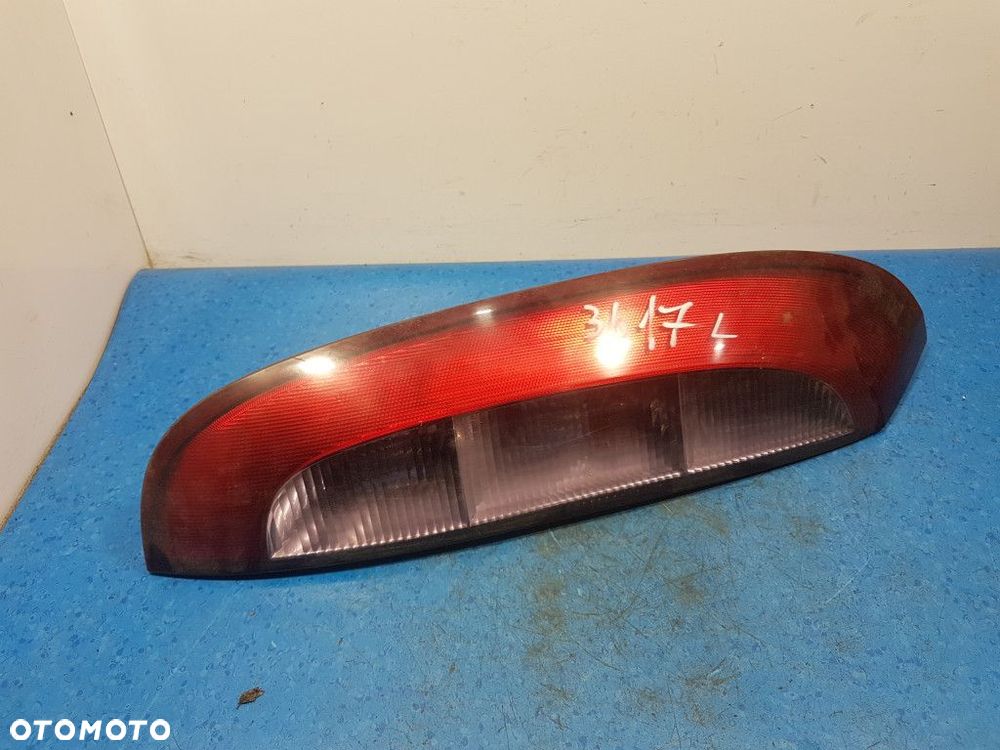 OPEL CORSA C LAMPA TYŁ LEWA ZEWNĘTRZNA - 1