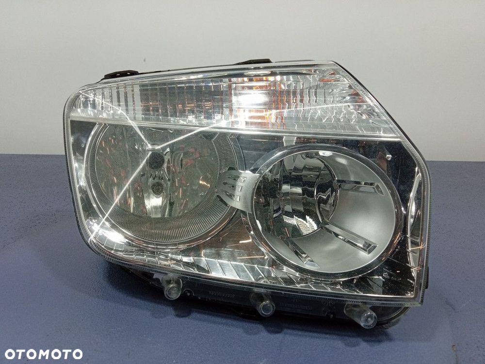 DACIA DUSTER I 10- REFLEKTOR PRAWY LAMPA EU 260100067R - 1