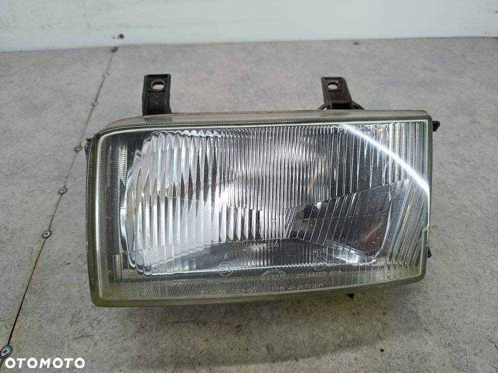 LAMPA PRZÓD LEWA VW TRANSPORTER T4 HELLA - 1
