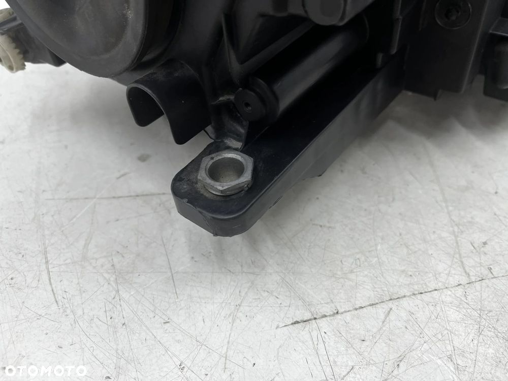 Lampa reflektor VW Tiguan 1 I 5n LIFT 10-16r. lewa przednia XENON EU skrętna doświetlanie zakrętów + - 19